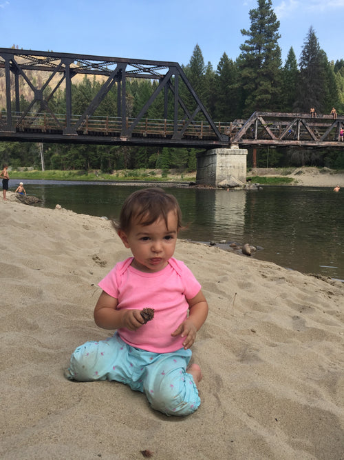 Child playing on the Kettle River BC